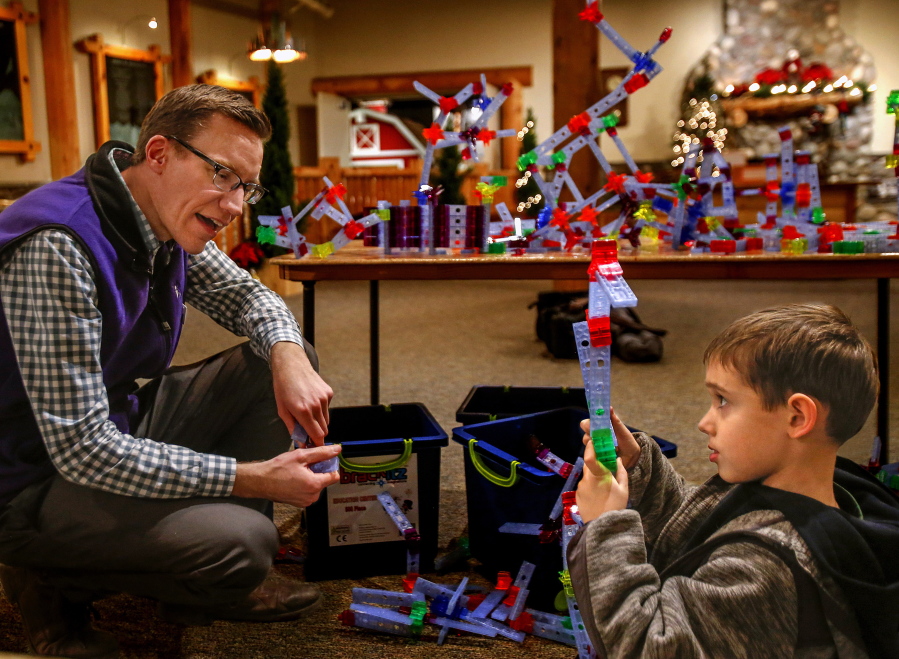Nick Spicher, a new program innovation manager at Everett’s Imagine Children’s Museum, talks with Ezra Tamas, 5. Spicher appeared on “Jeopardy!” Jan. 2.