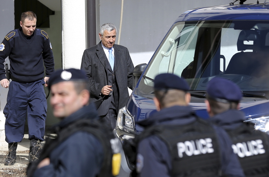 Kosovo Serb politician Oliver Ivanovic, center, leaves the prison in the northern, Serb-dominated part of Mitrovica, Kosovo, in 2007. 64-year old Ivanovic has died from wounds after being shot by unknown assailants Tuesday, according to his lawyer Nebojsa Vlajic.