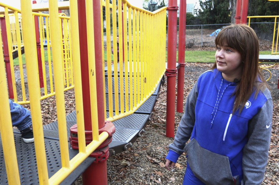 Adriana Dehonor watches her son, Ryder Dwire, climb in a playground Nov. 15 in Yakima. In 2014, Dehonor’s next-door neighbor fatally shot himself and the bullet pierced her bathroom wall almost wounding her. The gun used by her neighbor had previously been confiscated and resold by the Washington State Patrol.