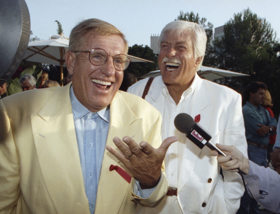 Jerry Van Dyke, left, and his brother, Dick, laugh during a party Aug. 25, 1992 in Los Angeles. Manager said Saturday, that Jerry Van Dyke, “Coach” star and younger brother of comedian Dick Van Dyke, has died in Arkansas at 86.
