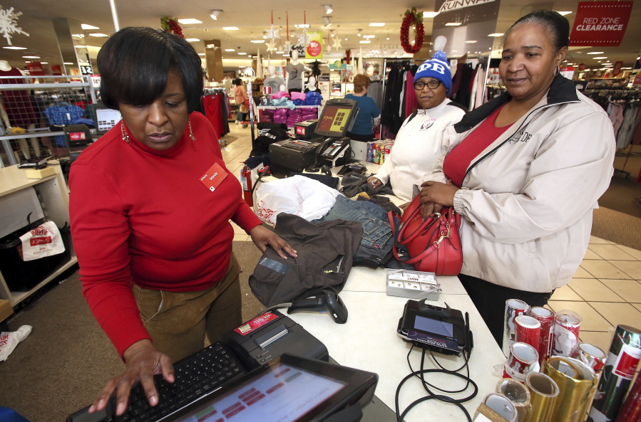 In this Tuesday, Dec. 26, 2017, file photo, J.C. Penney sales associate Wanda Cofield, left, assists Cynthia Putney, right, and Linda Pierce with returns and exchanges at the store, at Golden East Crossing mall in Rocky Mount, N.C. With the holiday season over, some shoppers are still wondering what to do with the unwanted gifts still hanging around. Shoppers have options, including swapping and selling online.