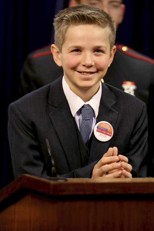 Dom Peters, Oregon’s first Kid Governor and a fifth grader at Willamette Valley Christian School, holds his first press conference at the state Capitol in Salem, Ore., Monday, Jan. 8, 2018.