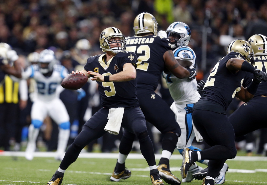 New Orleans Saints quarterback Drew Brees (9) passes in the first half of an NFL football game against the Carolina Panthers in New Orleans, Sunday, Jan. 7, 2018.