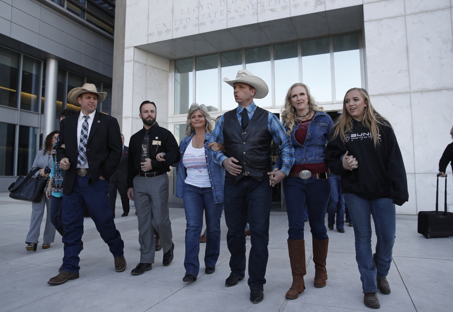 From left, Ammon Bundy, Ryan Payne, Jeanette Finicum, widow of Robert “LaVoy” Finicum, Ryan Bundy, Angela Bundy, wife of Ryan Bundy and Jamie Bundy, daughter of Ryan Bundy, walk out of a federal courthouse in Las Vegas on Monday, Jan. 8, 2018. Payne, a central figure who helped orchestrate the armed occupation of the Malheur National Wildlife Refuge, faces the longest sentence yet out of the defendants tied to the occupation.