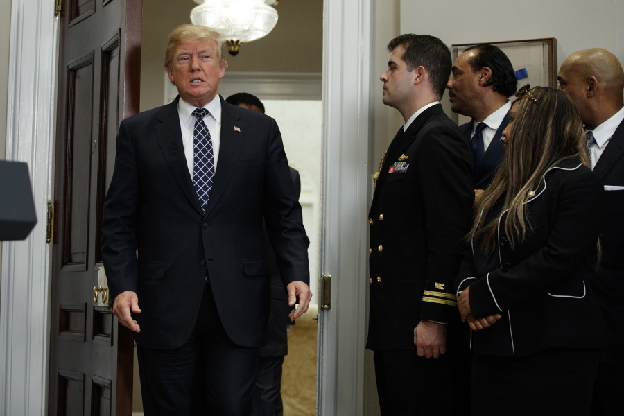 President Donald Trump arrives to an event to honor Dr. Martin Luther King Jr., in the Roosevelt Room of the White House, Friday, Jan. 12, 2018, in Washington.