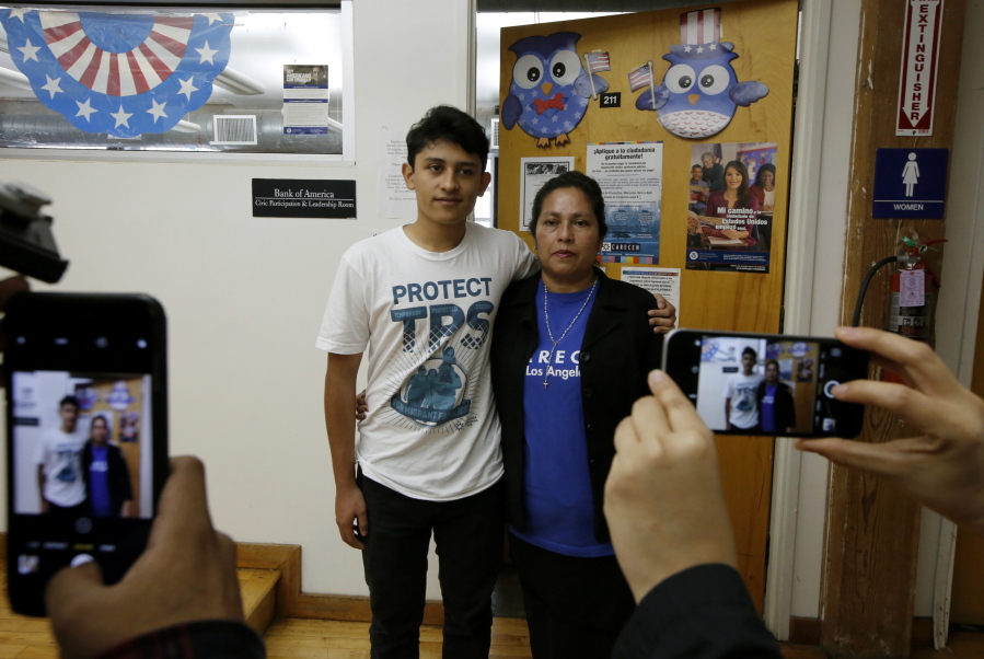 U.S. citizen Benjamin Zepeda, 14, with his mother Lorena Zepeda, who benefits from Temporary Protected Status have their photo taken after a news conference in Los Angeles, Monday, Jan. 8, 2018 The Trump administration said Monday it is ending special protections for Salvadoran immigrants, an action that could force nearly 200,000 to leave the U.S. by September 2019 or face deportation. El Salvador is the fourth country whose citizens have lost Temporary Protected Status under President Donald Trump. Salvadorans have by far been the largest beneficiaries of the program, which provides humanitarian relief for foreigners whose countries are hit with natural disasters or other strife.