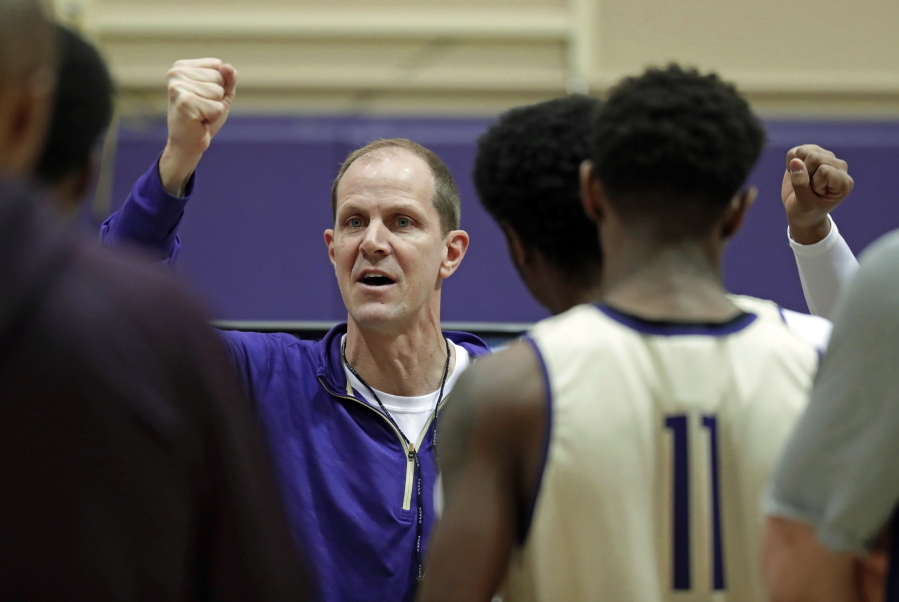 In this Friday, Jan. 26, 2018 photo, Washington head coach Mike Hopkins talks to his players in a huddle during NCAA college basketball practice in Seattle. One of the most surprising stories in college basketball is what Hopkins is doing in his first season at Washington and how the Huskies are in the conversation for an NCAA bid entering February. (AP Photo/Ted S.