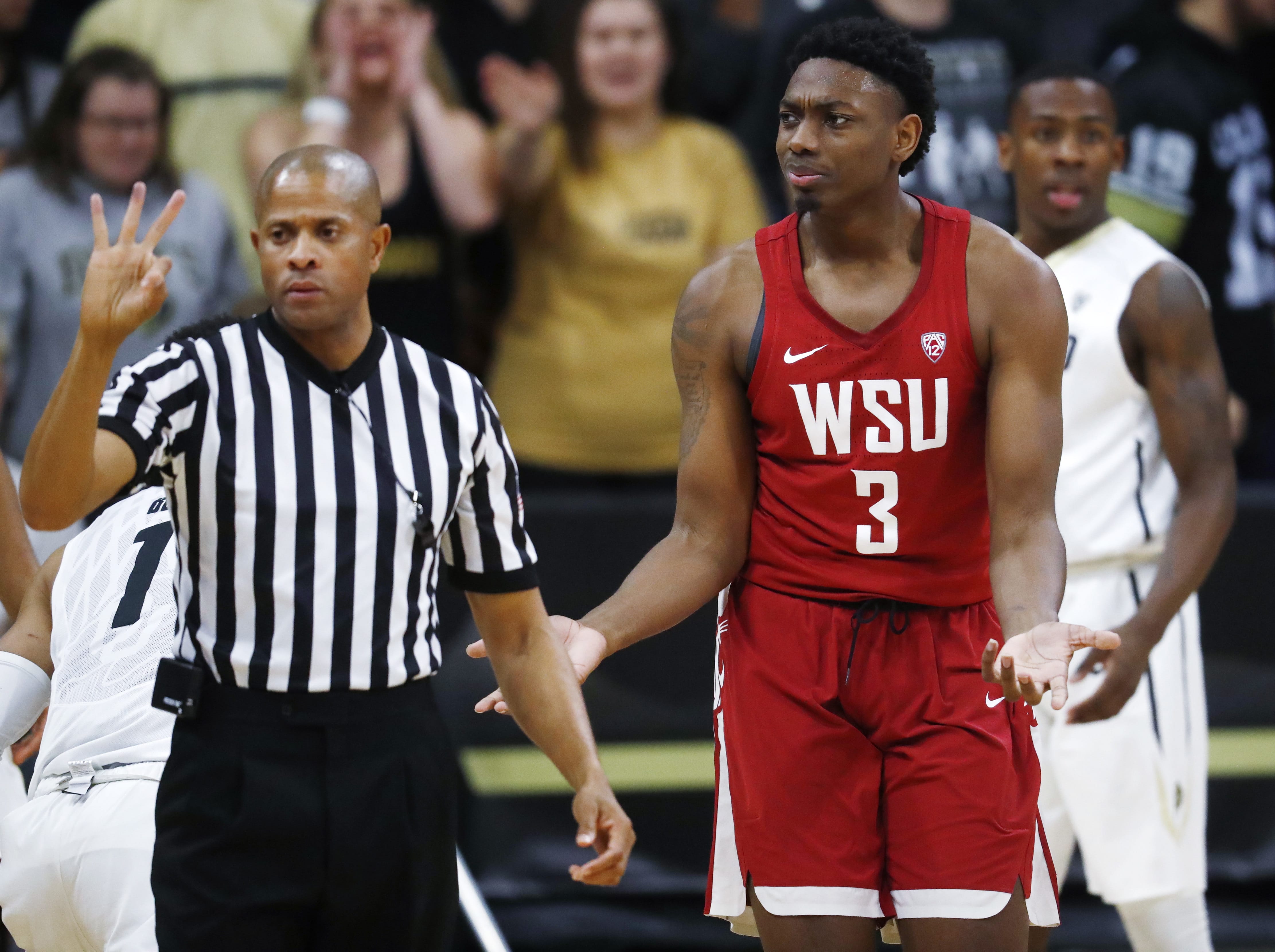 Washington State forward Robert Franks, right, argues with a referee after he was called for charging against Colorado in the second half of an NCAA college basketball game Thursday, Jan. 18, 2018, in Boulder, Colo.