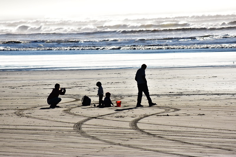 A family enjoys the day. Nearly 60 degrees on the Long Beach Peninsula, on January 13, 2017.