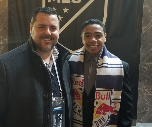 Niko De Vera (right) poses with Akron coach Jared Embick after De Vera was selected in the second round of the MLS SuperDraft by the New York Red Bulls (University of Akron photo)