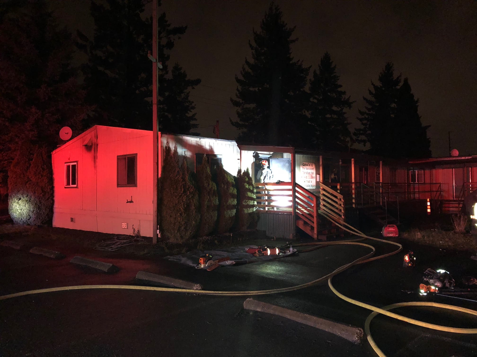 Firefighters respond to a fire in an office trailer at the former Pacific Rock Products quarry in east Vancouver Thursday night.