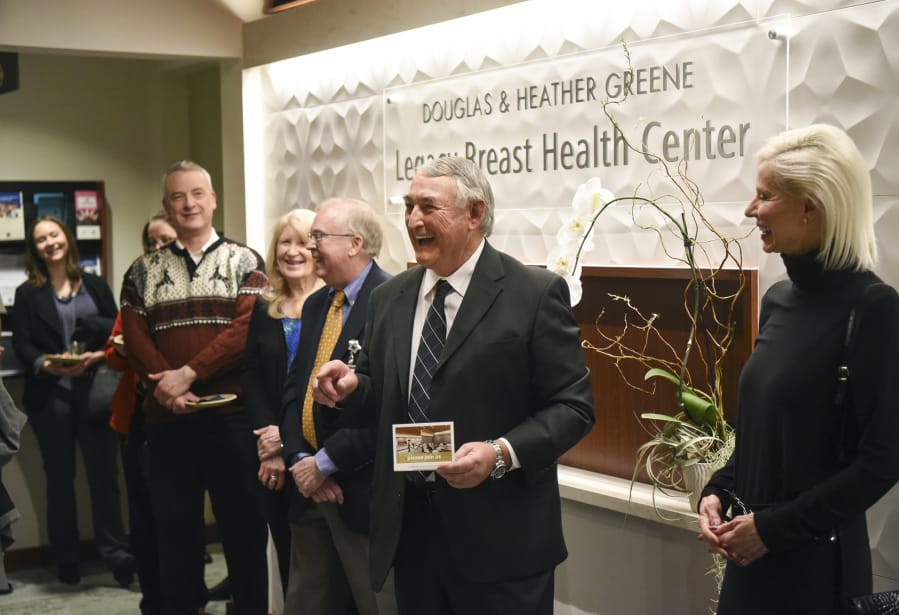 Douglas Greene, center, and his wife, Heather Greene, right, donated $500,000 toward efforts to create a comprehensive cancer center at Legacy Salmon Creek Medical Center in Vancouver. The hospital named the breast center after the couple.