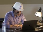 RealWear netted $17 million in investment near the end of January, according to filings with the Securities and Exchange Commission. An employee wears its head-mounted tablet while working last September.