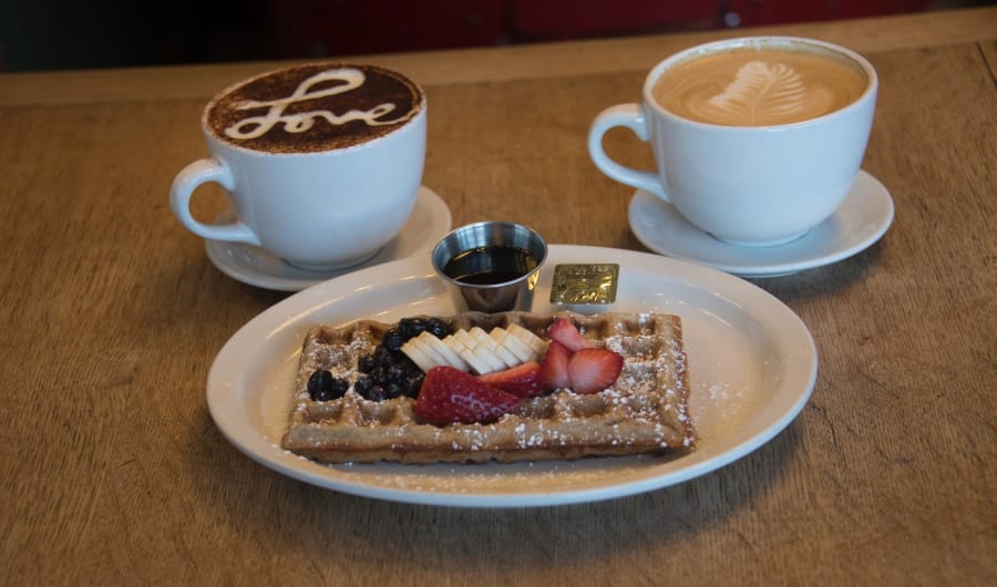 Macy’s made-from-scratch waffles with organic maple syrup, special coffee and latte at Macy’s European Coffee House and Bakery, Flagstaff, Ariz.