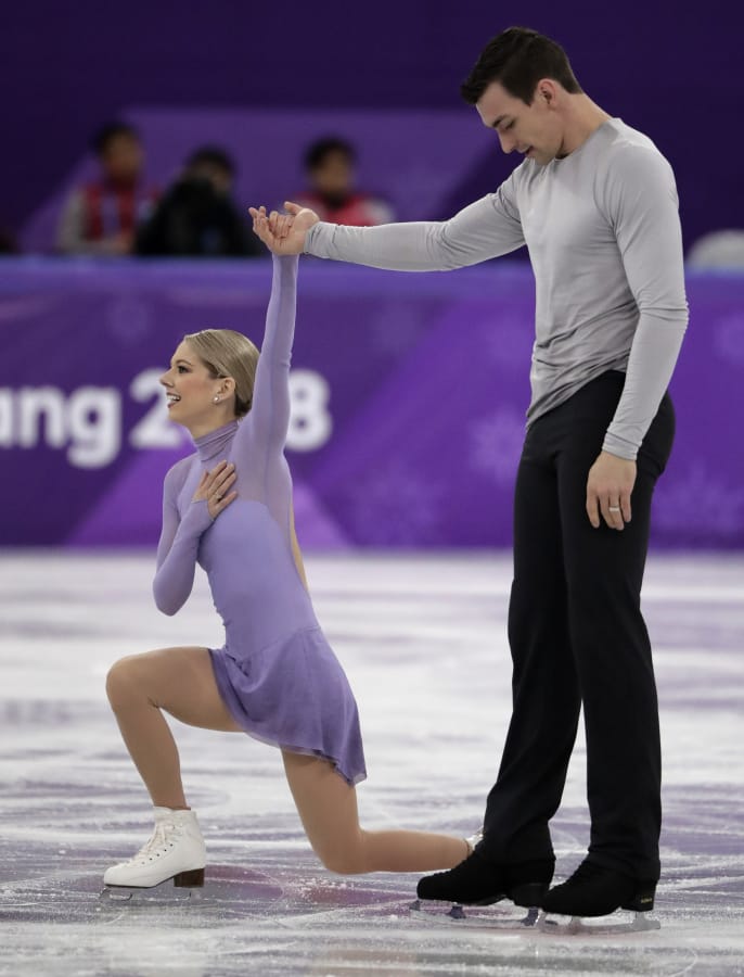 Alexa Scimeca Knierim and Chris Knierim of the USA react after their performance in the pairs free skate figure skating final in the Gangneung Ice Arena at the 2018 Winter Olympics in Gangneung, South Korea, Thursday, Feb. 15, 2018.