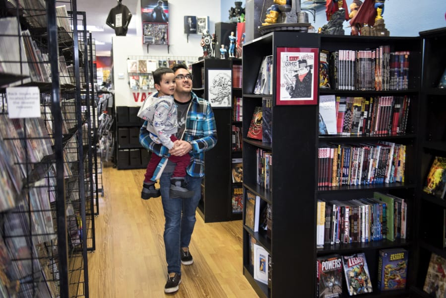 Luke Maeda treats his son Kaiden, 4, to a tour of the I Like Comics shop in downtown Vancouver. “It’s local, and they always have good prices and a good selection,” Maeda said.