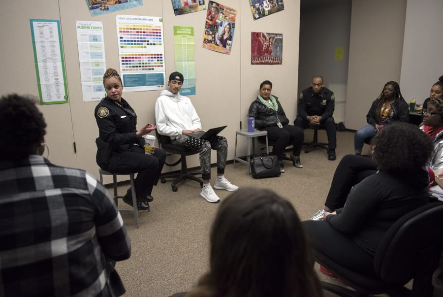 Portland Police Chief Danielle Outlaw talks with a group of Evergreen High School students during a Black Students United club meeting Thursday afternoon at the Vancouver school. The club launched this year in an effort to build unity at the predominantly white school.