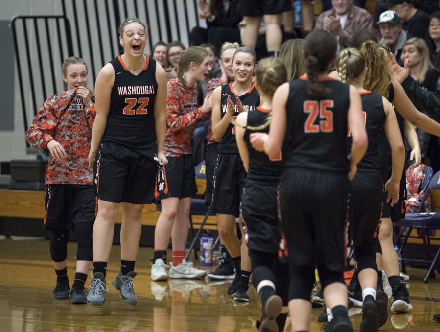 Washougal’s Emilee Smart (22) cheers on her teammates as they come off the court for a timeout during Thursday night’s game at Columbia River High School on Feb. 1, 2018. Washougal won 54-53.