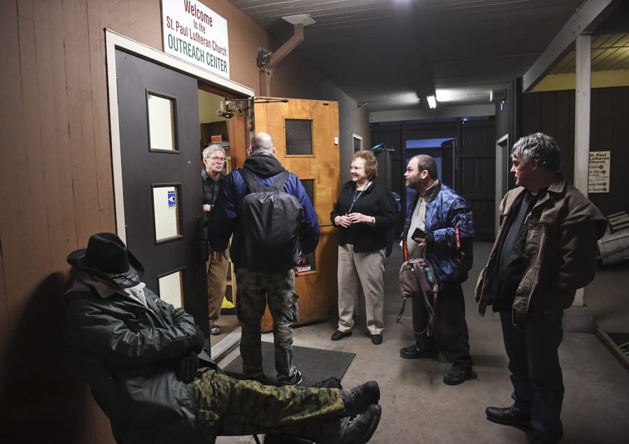 Men gather in the courtyard with volunteers at St. Paul Lutheran Church, one of two Lutheran churches in Vancouver that hosts the Winter Hospitality Overflow shelter program. Lutheran churches have a strong local presence in sheltering homeless people.