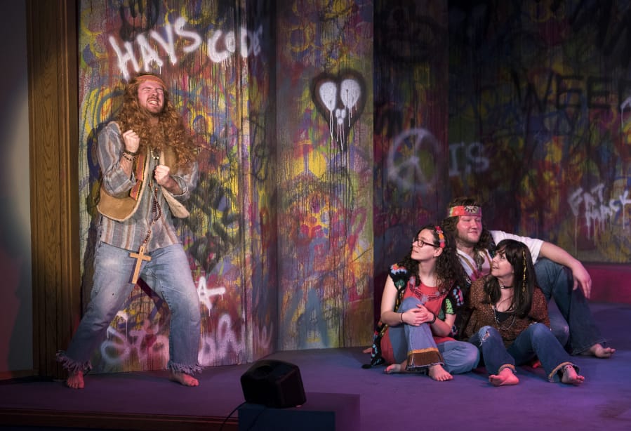 Andrew Hallas of Vancouver, left, belts out a solo during dress rehearsal of “Hair” at Clark College’s Decker Theater.