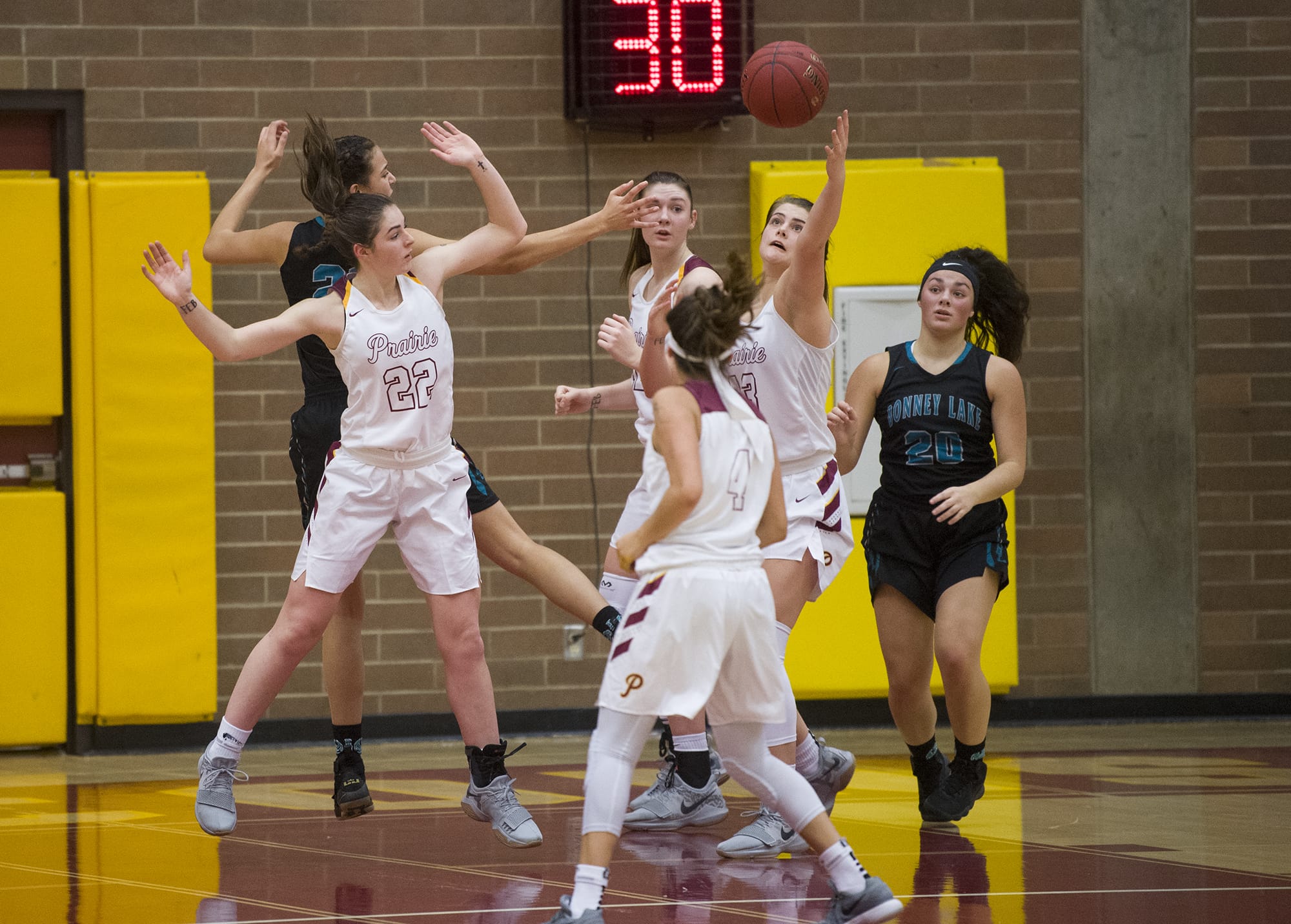 Prairie’s Mallory Williams (13) reaches out to catch the ball during the first round of the 3A bi-district girls basketball tournament against Bonney Lake at Prairie High School, Wednesday February 7, 2018.