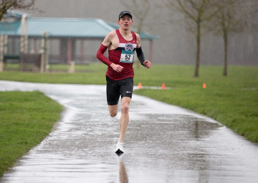 Jared Carson, of Portland, won the men’s portion of the Vancouver Lake Half Marathon, sponsored by the Clark County Running Club, Sunday morning, Feb. 25, 2018 at Vancouver Lake Regional Park. He had an official winning time of 1:07.42. Photo by Randy L.