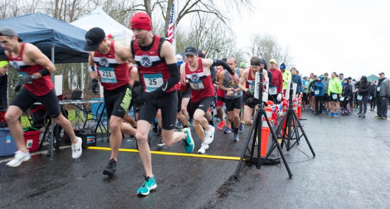 Runners take off at the start of the Vancouver Lake Half Marathon, sponsored by the Clark County Running Club, Sunday morning, Feb. 25, 2018 at Vancouver Lake Regional Park. Photo by Randy L.