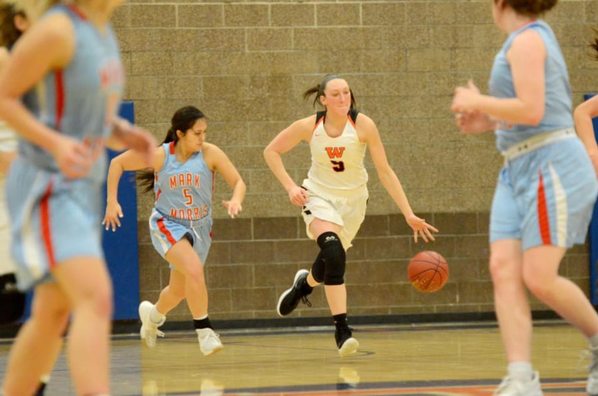 Washougal junior Beyonce Bea dribbles up court against Mark Morris during a 2A district tournament game at Ridgefield High School on Thursday, February 14, 2018. Washougal beat Mark Morris 64-49.