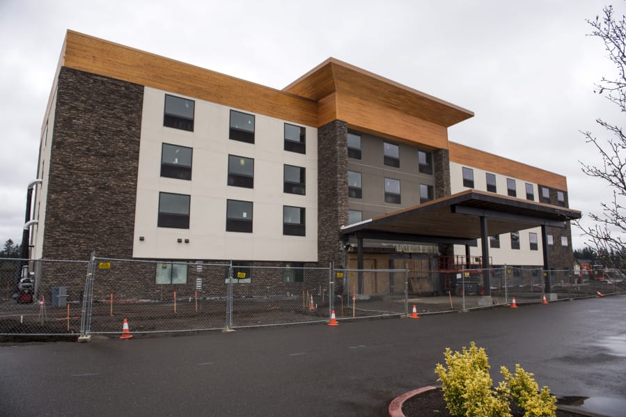 Construction continues Friday on the Holiday Inn Express in southeast Vancouver.
