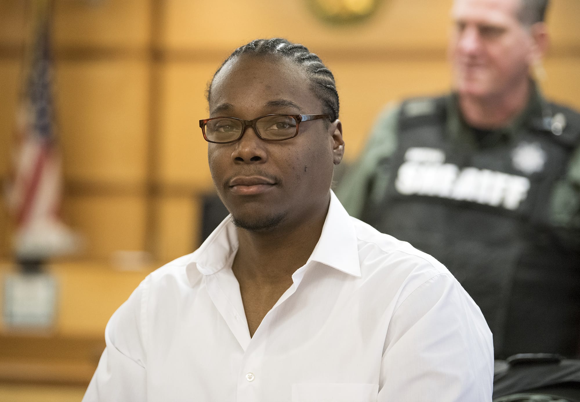 Arkangel D. Howard of Portland is escorted into Clark County Superior Court for opening statements in his double murder trial Wednesday. Howard is accused of fatally shooting two men at an east Vancouver apartment complex in March 2017.