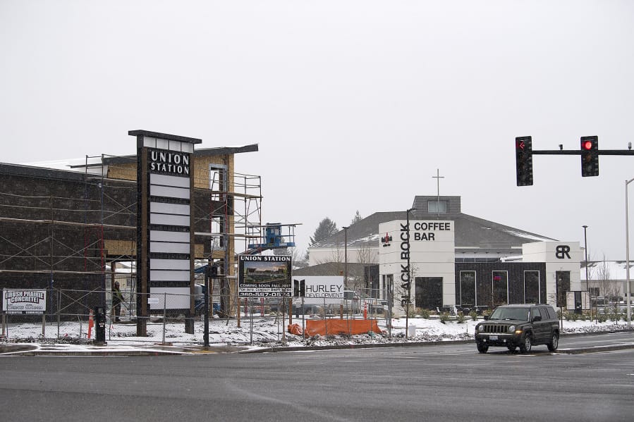 A motorist passes Union Station, under construction at 200 Northeast 192nd Avenue near the east Vancouver Costco store, on Tuesday morning. The mixed-use development will offer nearly 30,000 square feet of commercial space.