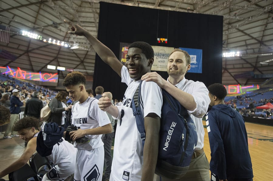 Skyview’s Samaad Hector (3) celebrates after making the game-winning basket over Glacier Peak on Wednesday.