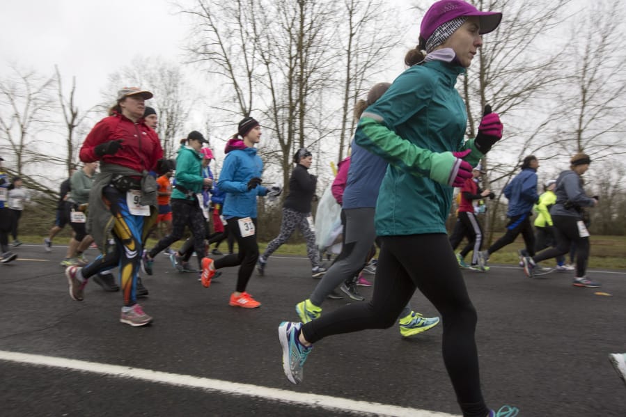 Racers take off from the starting line for the Vancouver Lake Half Marathon in 2017.