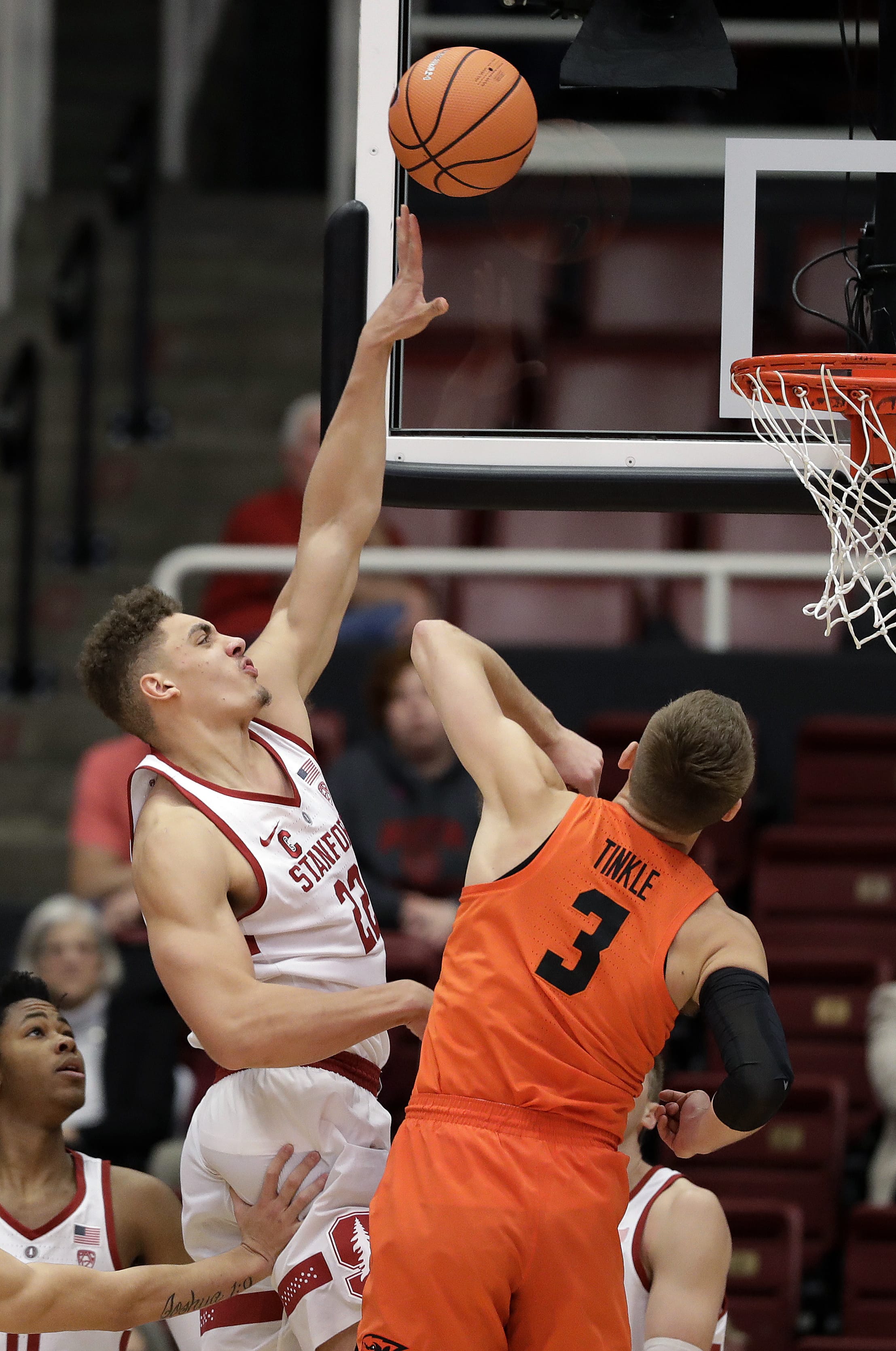 Stanford forward Reid Travis, left, shoots over Oregon State forward Tres Tinkle (3) during the first half of an NCAA college basketball game Thursday, Feb. 1, 2018, in Stanford, Calif.
