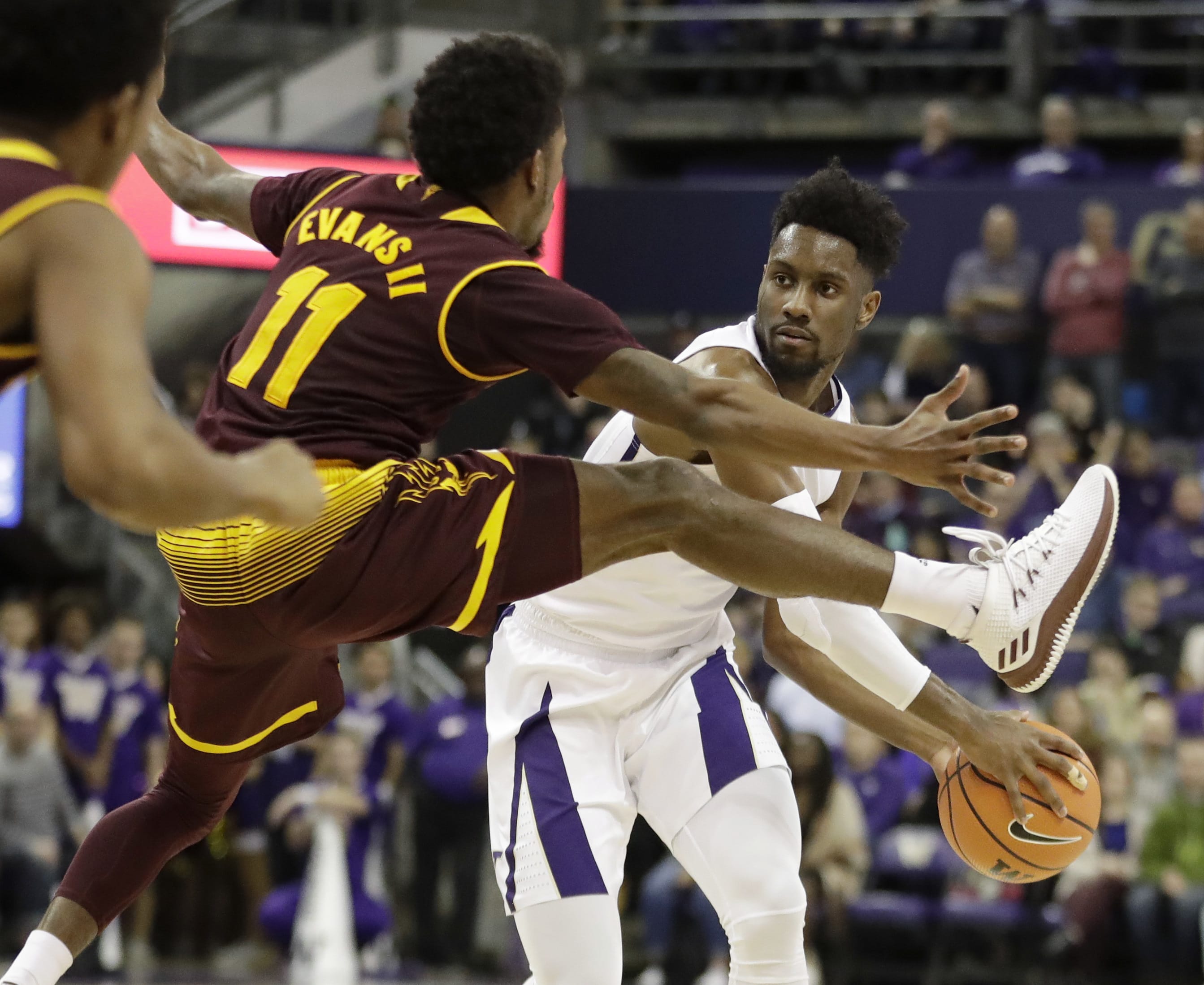 Arizona State guard Shannon Evans II (11) tries to block a pass by Washington guard Jaylen Nowell, right, in the first half of an NCAA college basketball game, Thursday, Feb. 1, 2018, in Seattle. (AP Photo/Ted S.