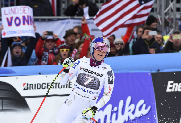 United States' Lindsey Vonn celebrates at the finish area during an alpine ski, women's world Cup downhill race, in Garmisch Partenkirchen, Germany, Sunday, Feb. 4, 2018.