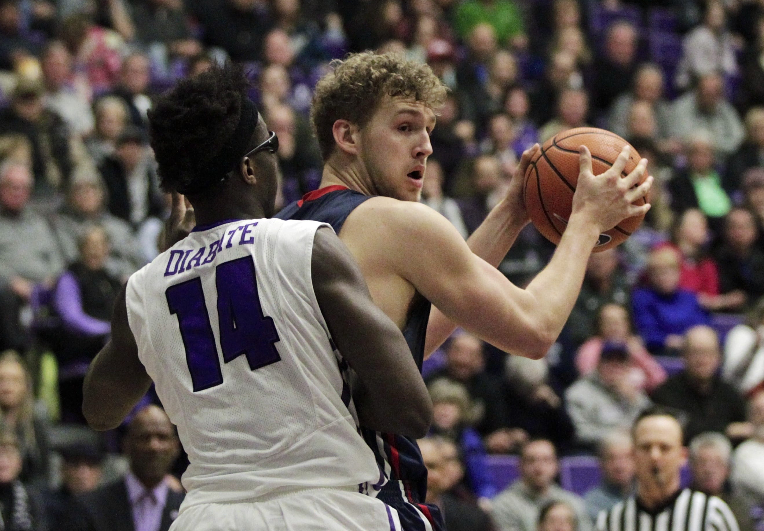Saint Mary's center Jock Landale, right, looks to pass as Portland forward Tahirou Diabate defends during the first half of an NCAA college basketball game in Portland, Ore., Saturday, Feb. 17, 2018.