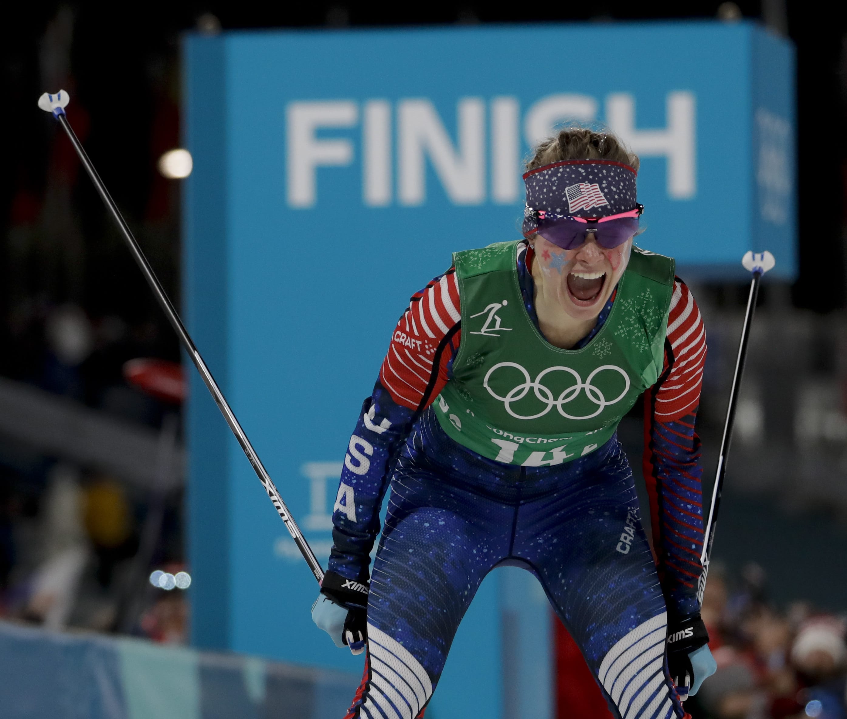 Jessica Diggins, of the United States, celebrates after winning the gold medal in the during women's team sprint freestyle cross-country skiing final at the 2018 Winter Olympics in Pyeongchang, South Korea, Wednesday, Feb. 21, 2018.