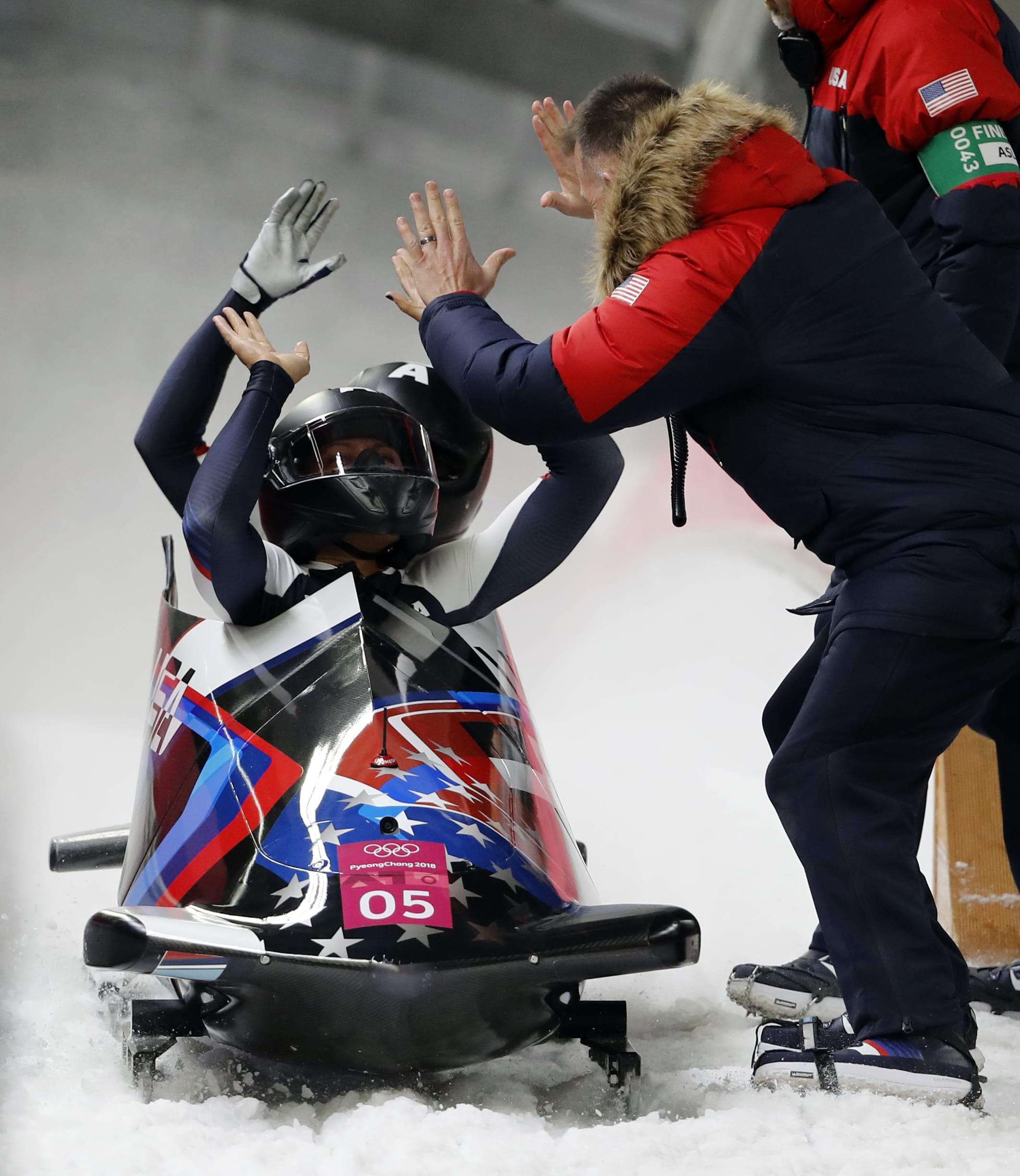 Driver Elana Meyers Taylor and Lauren Gibbs of the United States celebrate after their silver medal winning heat during the women's two-man bobsled final at the 2018 Winter Olympics in Pyeongchang, South Korea, Wednesday, Feb. 21, 2018.