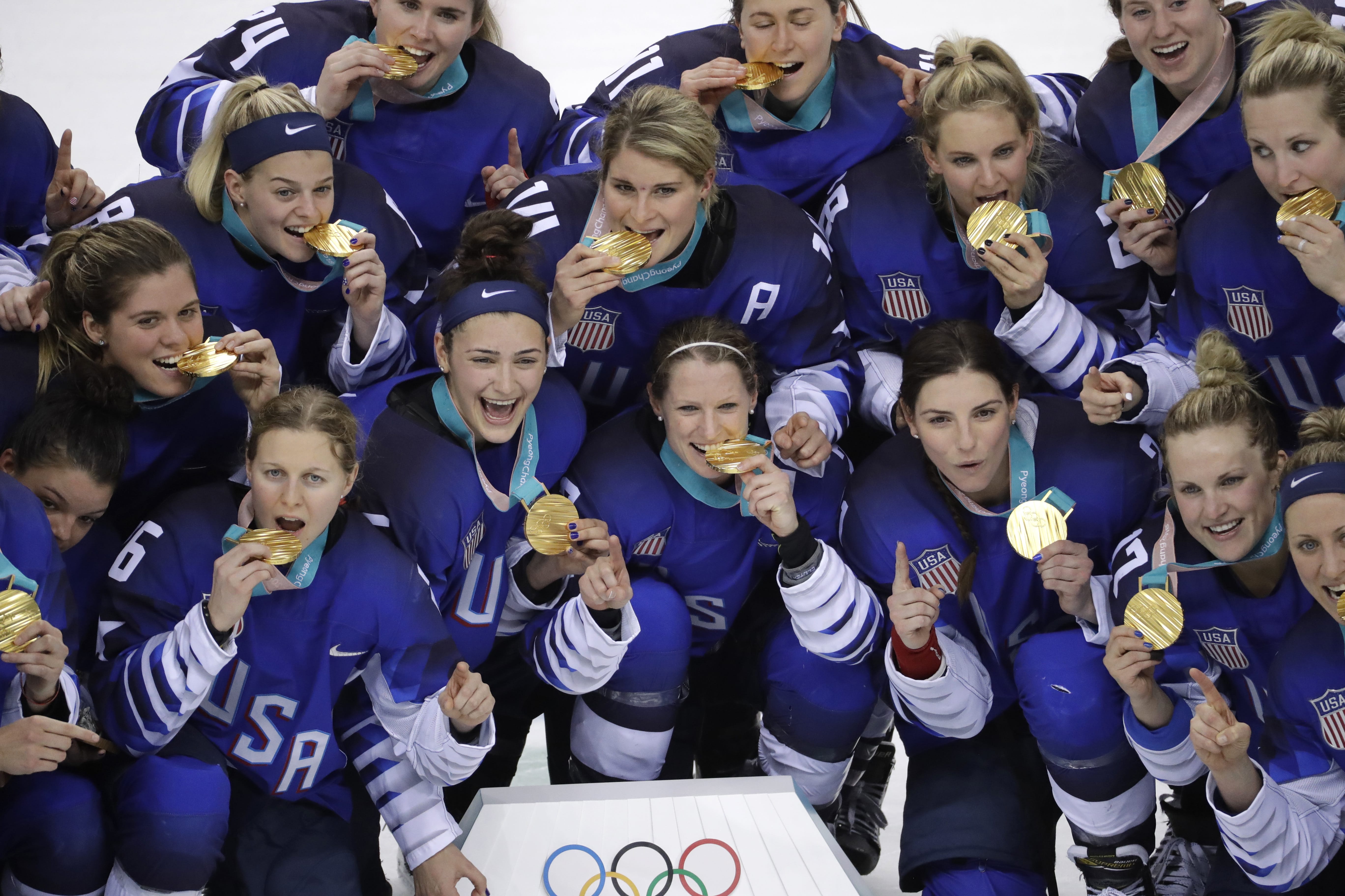Untied States hockey team celebrate with their gold medals after beating Canada in the women's gold medal hockey game at the 2018 Winter Olympics in Gangneung, South Korea, Thursday, Feb. 22, 2018.