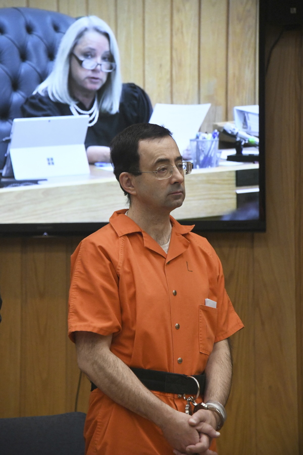 Larry Nassar appears in the court of Judge Janice Cunningham for sentencing on Monday in Charlotte, Mich. Cunningham sentenced Nassar on Monday to between 40 and 125 years in prison for sexually abusing patients at an elite gymnastics club.