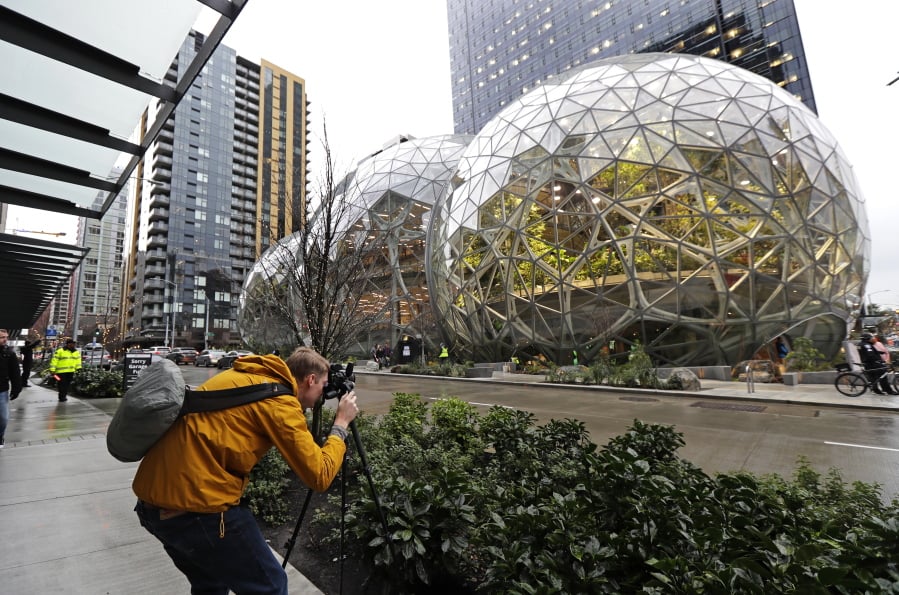 Alex Crook, a photographer with Seattle Magazine, photographs the Amazon Spheres Jan. 29 in Seattle Ted S.