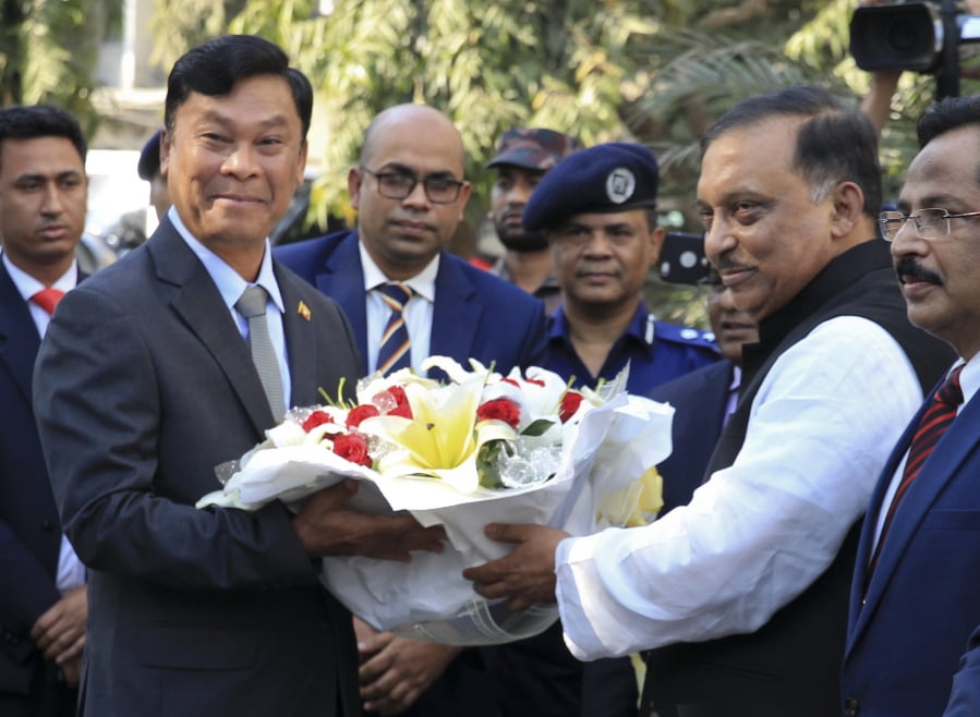 Bangladesh’s Home Minister Asaduzzaman Khan, second right, receives Myanmar’s Home Minister Kyaw Swe, second left, in Dhaka, Bangladesh, Friday, Feb.16, 2018. Kyaw Swe, on a three-day visit to Bangladesh told Bangladesh’s president that Myanmar is ready to take back Rohingya Muslims who fled violence, though Bangladesh said it wanted the hundreds of thousands of refugees to have a safe and dignified return.
