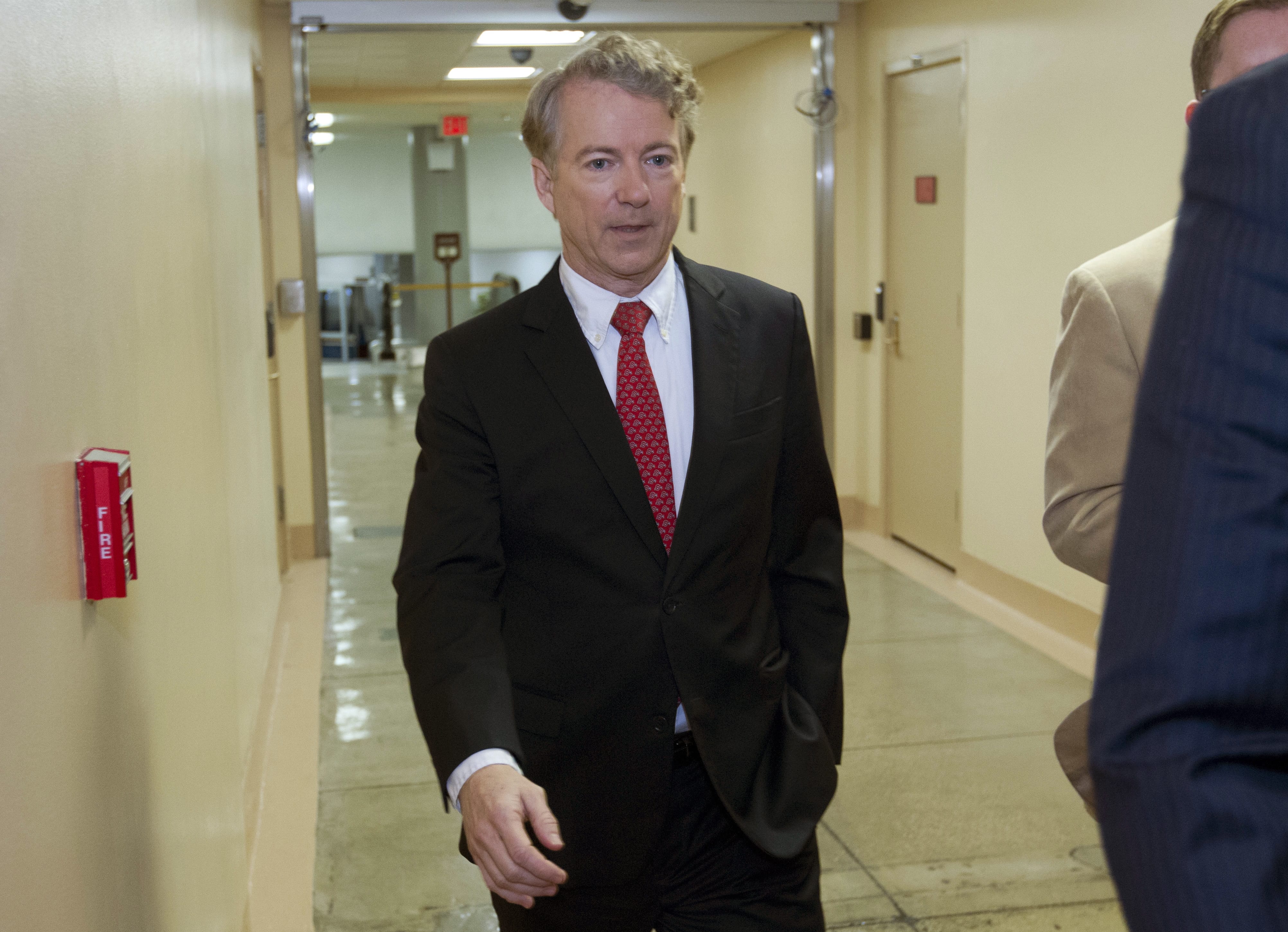Sen. Rand Paul, R-Ky., walks to the Senate chamber, at the U.S. Capitol, Thursday, Feb. 8, 2018, in Washington.
