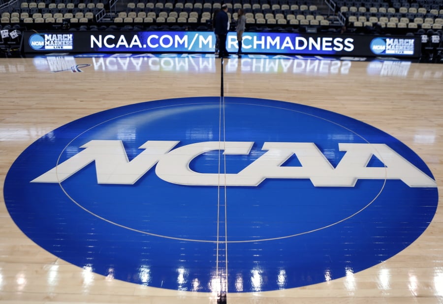 The NCAA logo is at center court as work continues at The Consol Energy Center in Pittsburgh, for the NCAA college basketball second and third round games. Bank records and other expense reports that are part of a federal probe into college basketball list a wide range of impermissible payments from agents to at least two dozen players or their relatives, according to documents obtained by Yahoo Sports. Yahoo said Friday that the documents obtained in discovery during the investigation link current players including Michigan State’s Miles Bridges, Duke’s Wendell Carter and Alabama’s Collin Sexton to potential benefits that would be violations of NCAA rules.