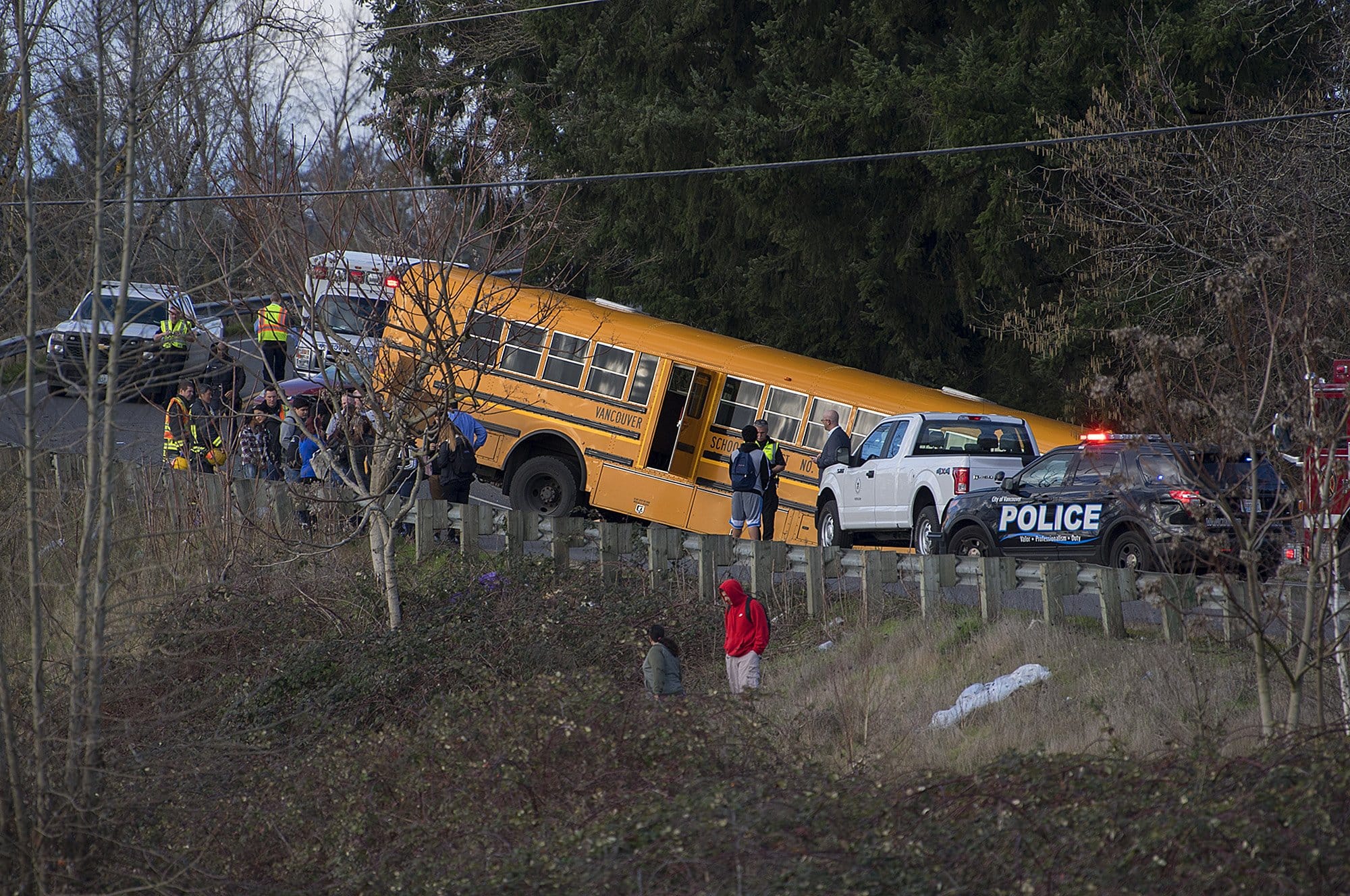A school bus went over embankment on Fruit Valley Road with kids on board. No injuries were reported. Traffic is routed around scene.