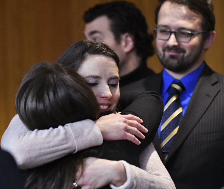 Rachael Denhollander hugs Det. Lt. Andrea Munford on Monday after the third and final day of sentencing in Eaton County Court in Charlotte, Mich., where Nassar was sentenced on three counts of sexual assault.