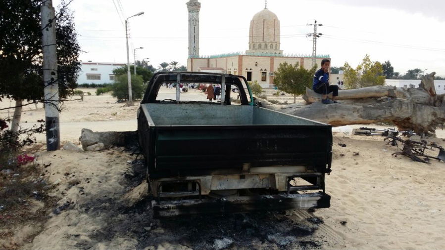 FILE - In this Nov. 25, 2017 file photo, a burned truck is seen outside Al-Rawda Mosque in Bir al-Abd northern Sinai, Egypt a day after attackers killed hundreds of worshippers. Egypt’s military says it has begun a major security operation in areas including the restive northern Sinai Peninsula, where Islamic militants are most active.