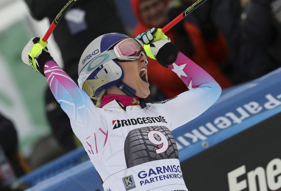 United States’ Lindsey Vonn celebrates her victory in the finish area after a women’s World Cup downhill race in Garmisch-Partenkirchen, Germany, Saturday, Feb. 3, 2018.