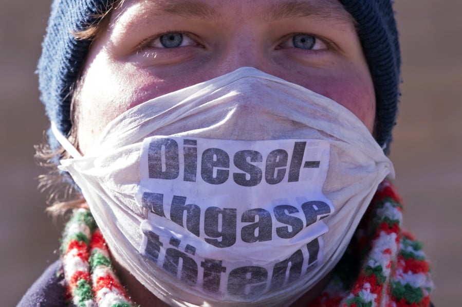 An environmental activist stands in front of the Federal Administrative Court on Tuesday in Leipzig, Germany.